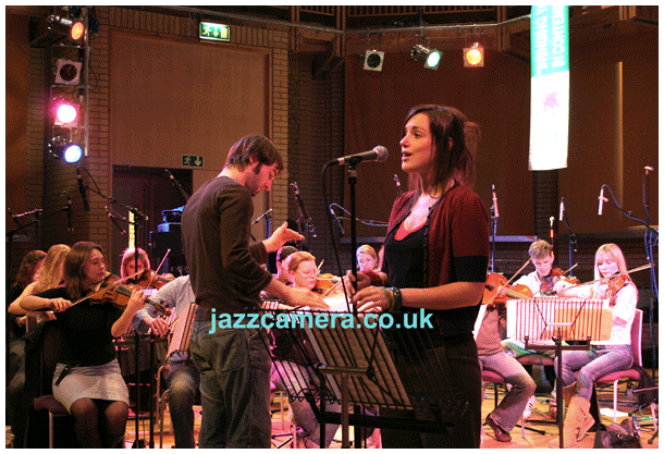 Jules Buckley, conductor, Lizzy Parks, singer, with the Heritage Orchestra